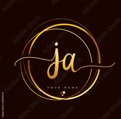 JA Initial handwriting logo golden color. Hand lettering Initials logo branding, Feminine and luxury logo design isolated on black background. photo