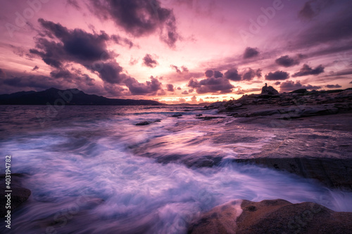 Sunset over tower and rocky coastline of Corsica © Jon Ingall