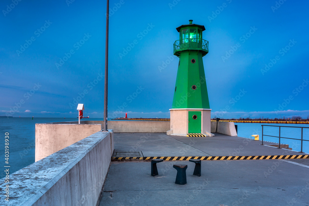 Lighthouse on the west breakwater in Nowy Port at dusk, Gdańsk. Poland