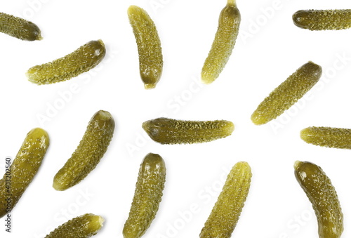 Pickled gherkin pile, pickles isolated on white background, top view pattern
