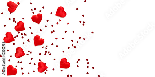Red romantic hearts on a white background with copy space. Valentine's day texture. Love concept. Top view