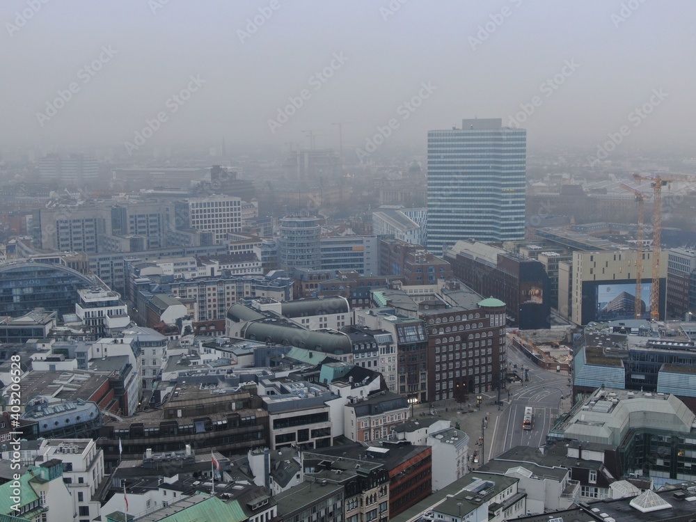Aerial view on to the cityscape of Hamburg, Germany with bad weather creating a mystical atmosphere