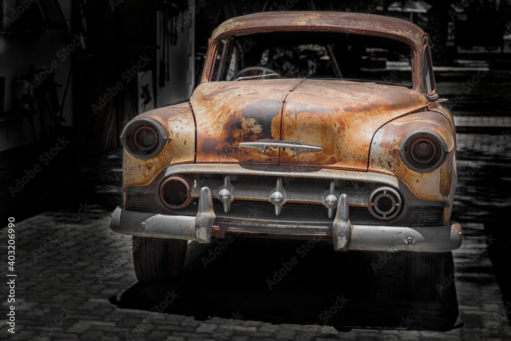 front of a parking rusty antique car front of a parking rusty antique car