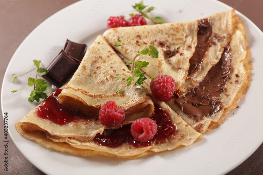 crepe with chocolate spread and raspberry fruit jam crepe with chocolate spread and raspberry fruit jam