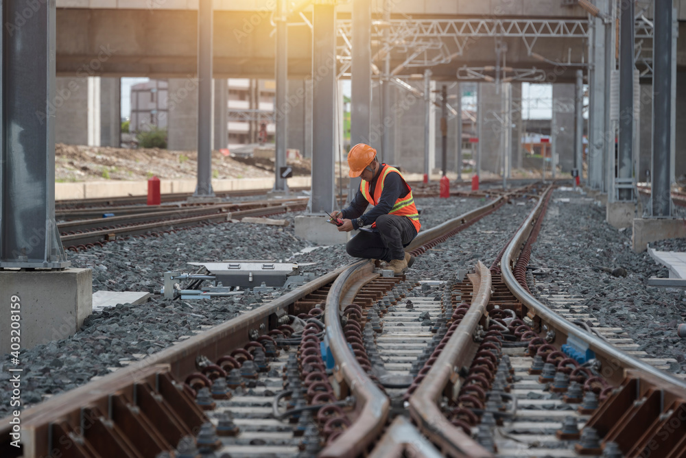 Fototapeta premium engineer sitting on railway inspection. construction worker on railways. Engineer work on railway.rail,engineer,Infrastructure
