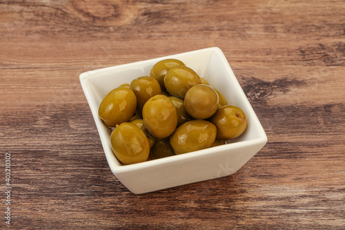 Green pickled olives in the bowl
