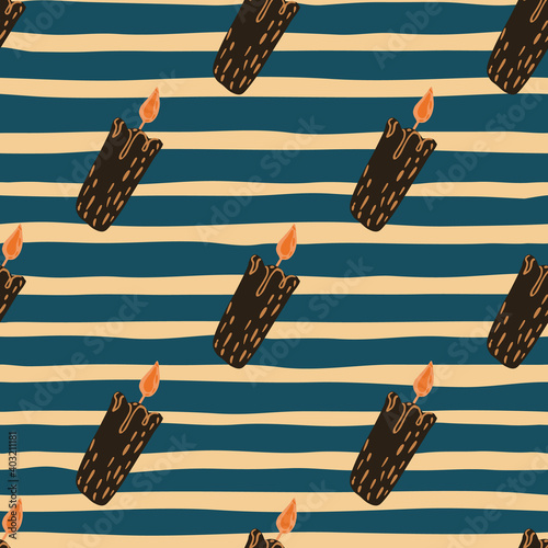 Cozy decoration seamless pattern with brown candle print. Navy blue striped background.