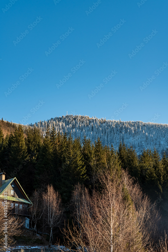 Frozen Lysa hora hill from Butoranka in Moravskoslezske Beskydy mountains in Czech republic