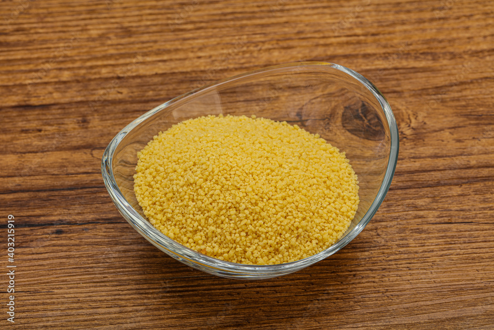 Raw cous cous heap in the bowl Raw cous cous heap in the bowl