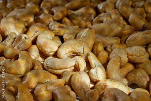 Wallpaper Mural Cashew close up. Texture of nuts. Lots of nuts in a pile. Contrasting dramatic light as an artistic effect. Torontodigital.ca