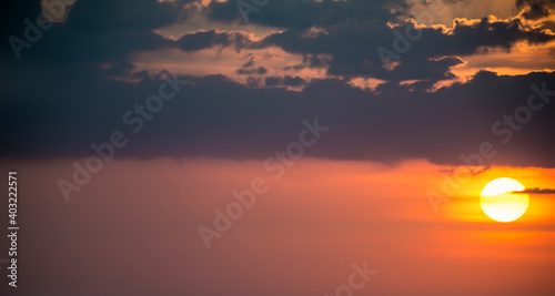 Fototapeta Naklejka Na Ścianę i Meble -  Stunning view of a dramatic sky with clouds at sunset. Natural background, wallpaper or preset with copy space.