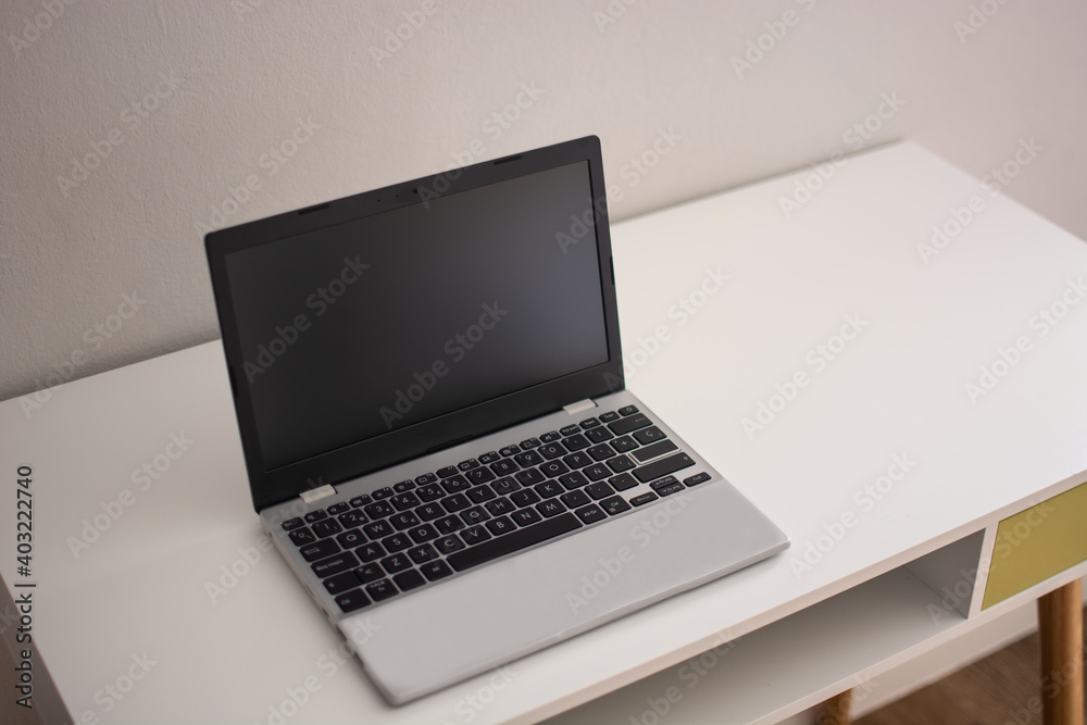 Modern workspace with laptop on desk