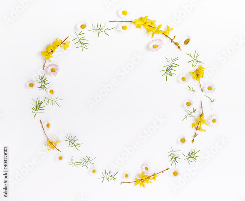 Spring frame of small flowers and daisy, floral arrangement