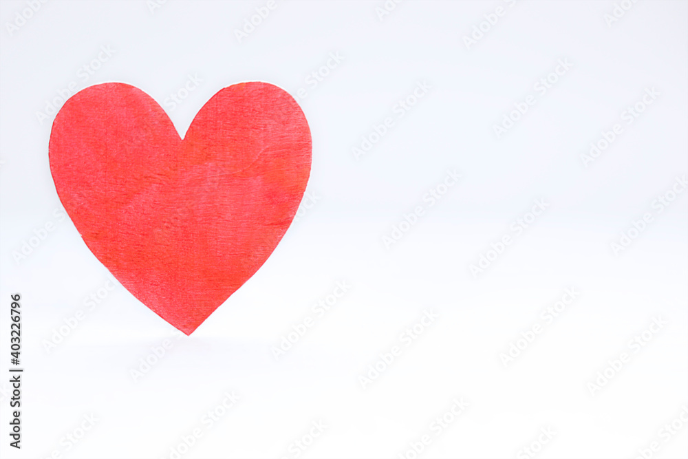 Background of one wooden heart against white background