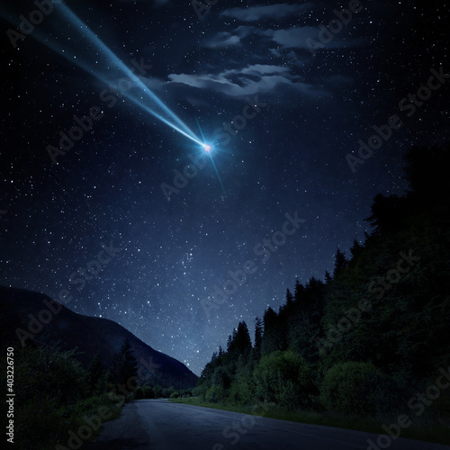 Canvas Print Night scene with a comet, asteroid, meteorite flying to Earth