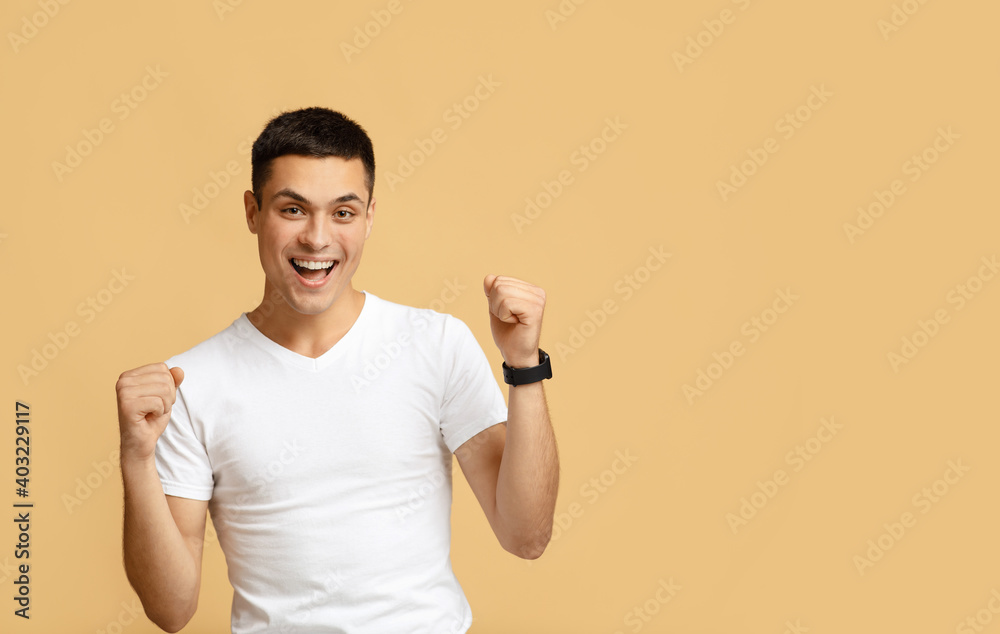 Excited happy student screams with happiness, celebrates his greatest triumph and victory Excited happy student screams with happiness, celebrates his greatest triumph and victory