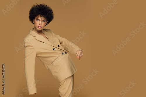  Happy curly-haired girl afro american in stylish suit