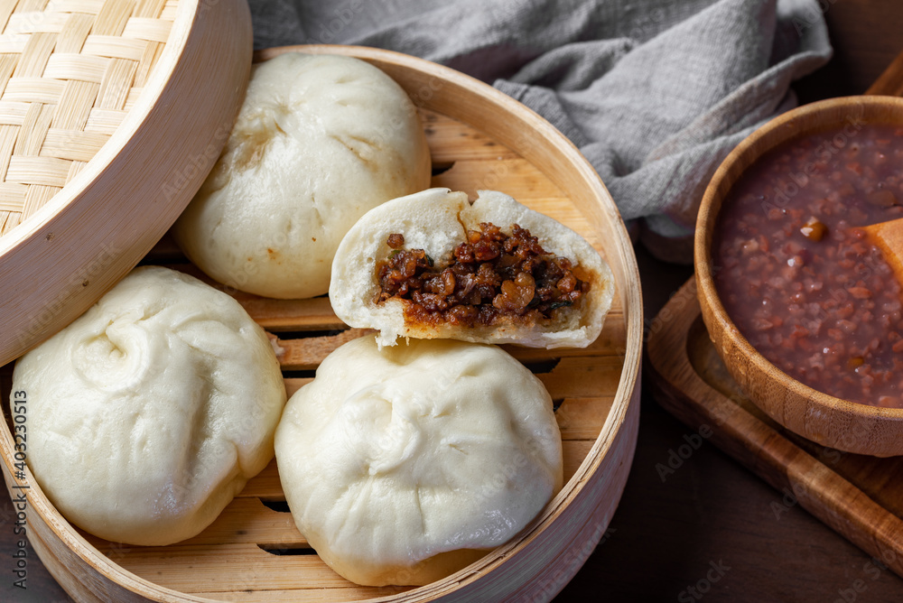 Chinese breakfast. Steamed buns and porridge are on the table Chinese breakfast. Steamed buns and porridge are on the table
