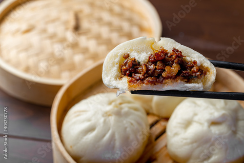 Chinese breakfast. Steamed buns and porridge are on the table photo