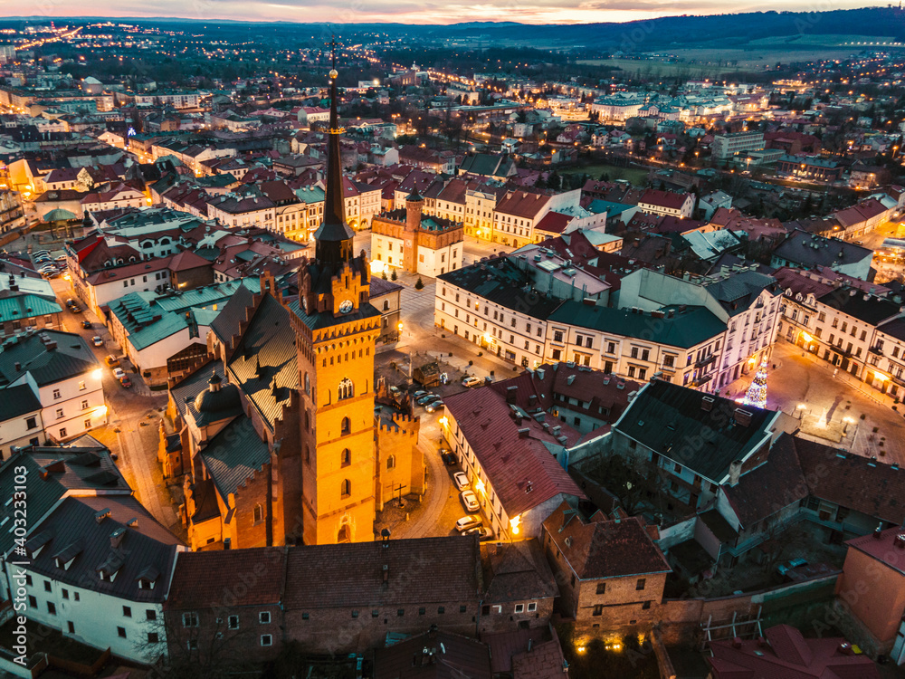 Fototapeta premium Skyline of Tarnow in Lesser Poland Illuminated at Blue Hour. Aerial Drone View of Old Town and Cathedral Church