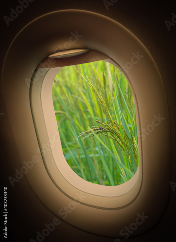 Plane window and view from plane to someplace  plane window with view of look out and see the freshness of nature  Freshness increases the energy of the morning. Holiday  relax and travel concept.