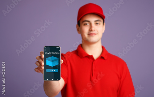 Courier man holding smartphone with delivery tracking app