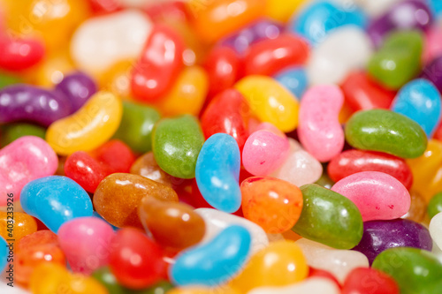 A plate of colourful Jelly Beans on a white background