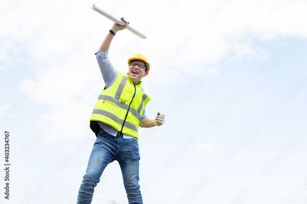 Success Asian man construction worker in hardhat. Celebration victory Success winning Leadership Concept