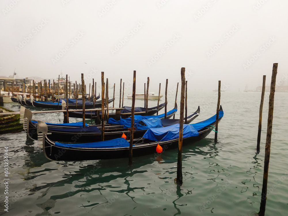 Gondolas in Venice on a misty December morning