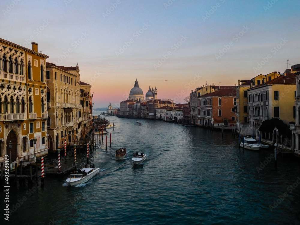 View along the grand canal Venice from the rialto bridge towards the Venetian Lagoon at sunset