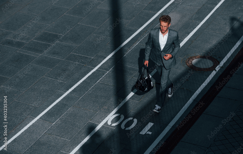 custom made wallpaper toronto digitalView from the top. Young businessman in grey formal wear is outdoors in the city