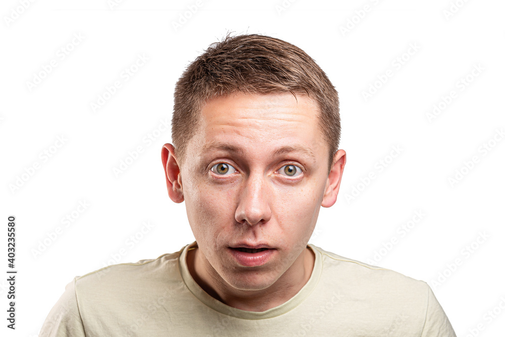 Obraz premium Funny young guy portrait isolated on white background.