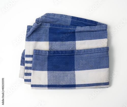 folded white cotton fabric with blue stripes on white background
