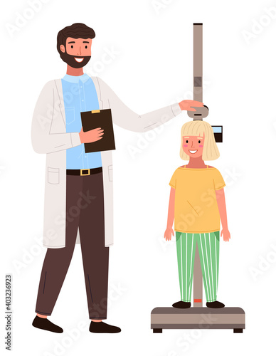 Girl on medical check-up with male pediatrician doctor. Physical examination of the growth process. The doctor measures the child s height. Little patient at the appointment with a pediatrician