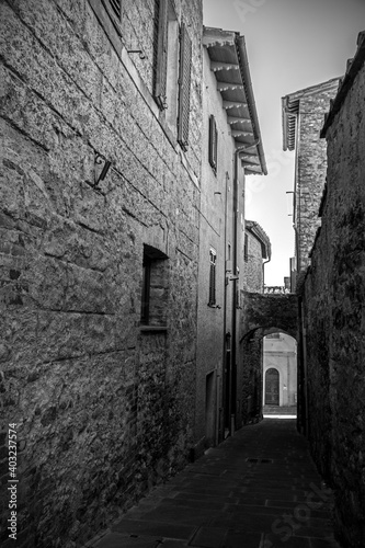 A quiet residential street in the historic medieval village of Batignano  Grosseto Province  Tuscany  Italy 