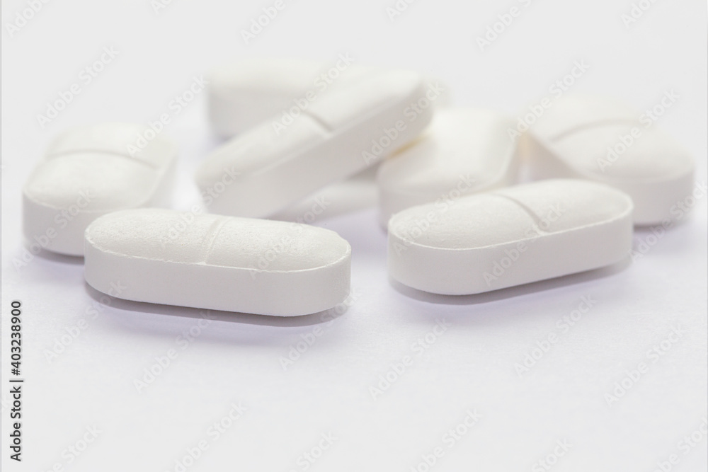 Paracetamol tablets isolated on a white background with selective focus. Paracetamol tablets isolated on a white background with selective focus.