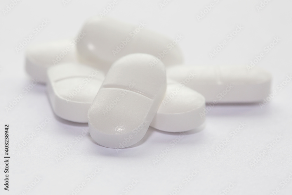 Paracetamol tablets isolated on a white background with selective focus. Paracetamol tablets isolated on a white background with selective focus.