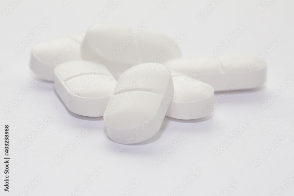 Paracetamol tablets isolated on a white background with selective focus. Paracetamol tablets isolated on a white background with selective focus.