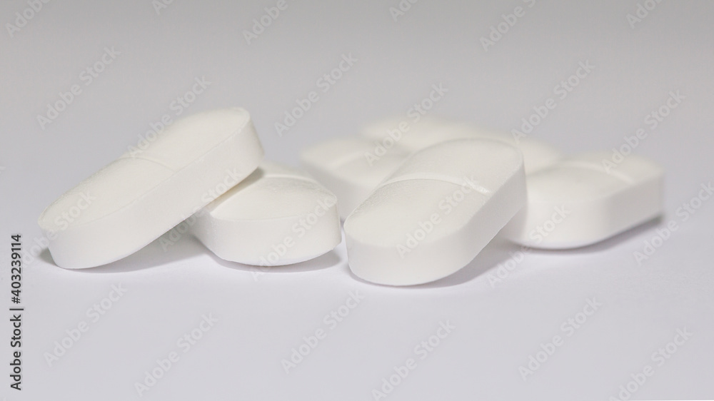 Paracetamol tablets isolated on a white background with selective focus. Paracetamol tablets isolated on a white background with selective focus.