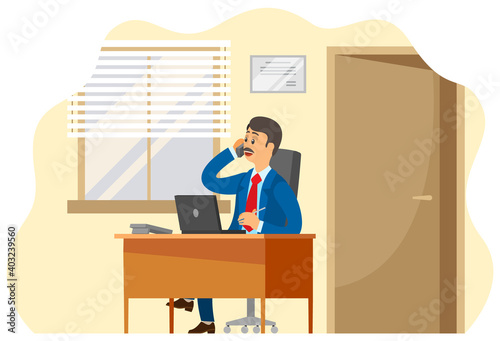 Smiling man dressed formally talking on the phone. Businessman working at the computer sitting at a table in office space. Manager doing work on the laptop. Serious man communicates and takes notes
