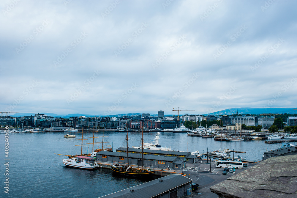 Oslo, Norway, July 27, 2013: port, Oslo's port area with vintage sailboats on a cloudy day. 