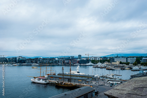 Oslo, Norway, July 27, 2013: port, Oslo's port area with vintage sailboats on a cloudy day.  © oksanamedvedeva