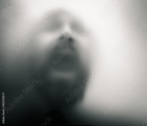Bild auf Leinwand scary picture of hands behind glass