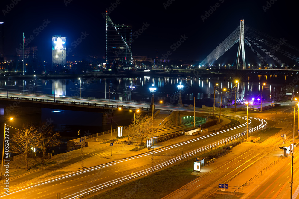 Night view of the bridge over the Daugava river