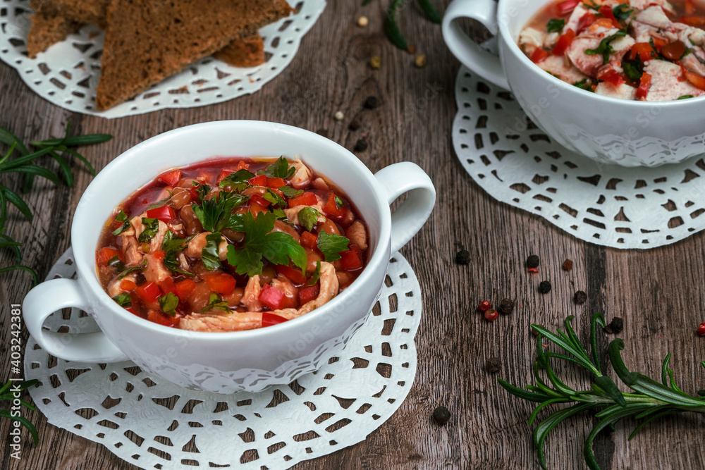 homemade vegetable soup on a wooden table, soup with chicken and beans homemade vegetable soup on a wooden table, soup with chicken and beans