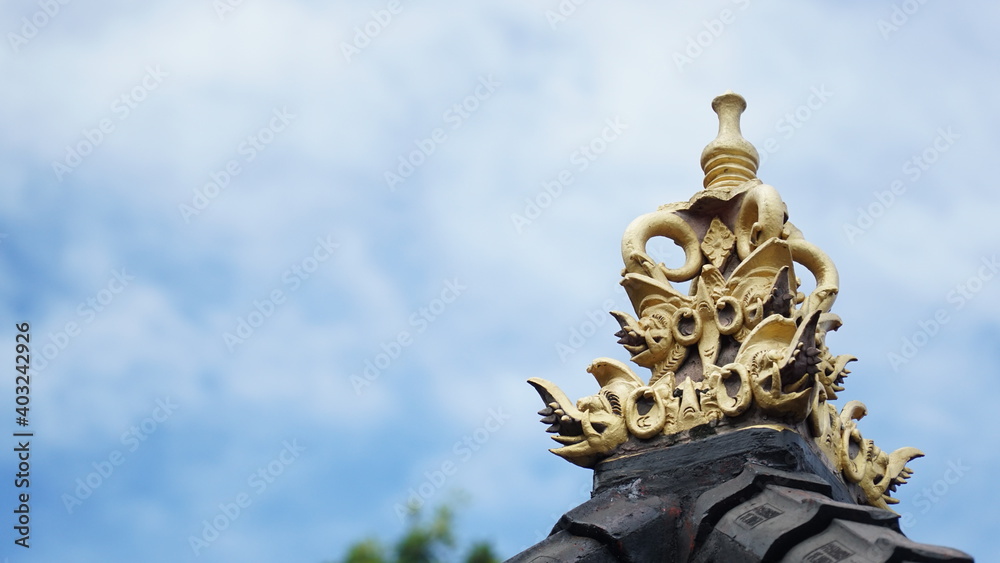 Balinese temple ornament with a combination of gold and black