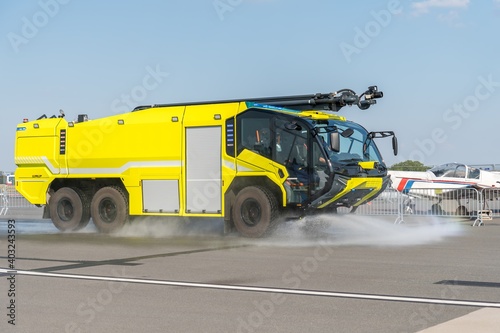 Yellow fire truck on the airport runway