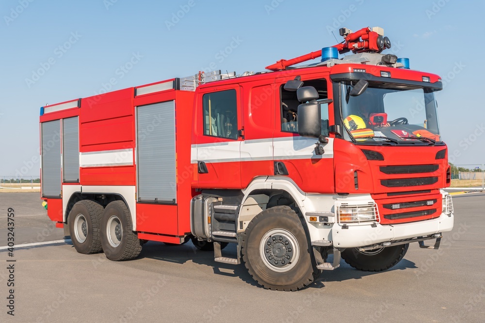 Red fire truck on the airport runway