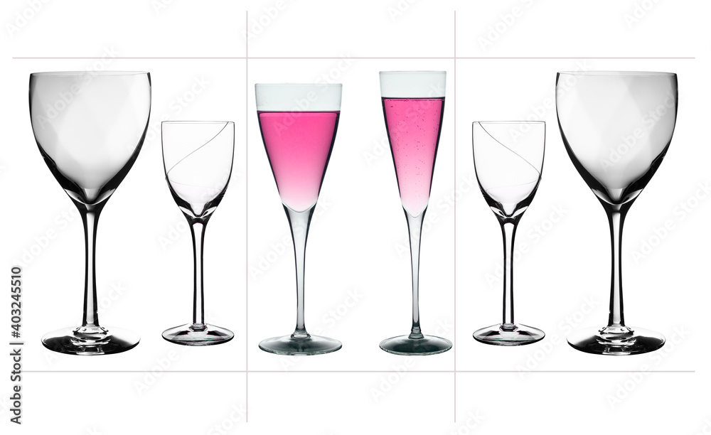 transparent crystal glasses with a colored drink on a white background