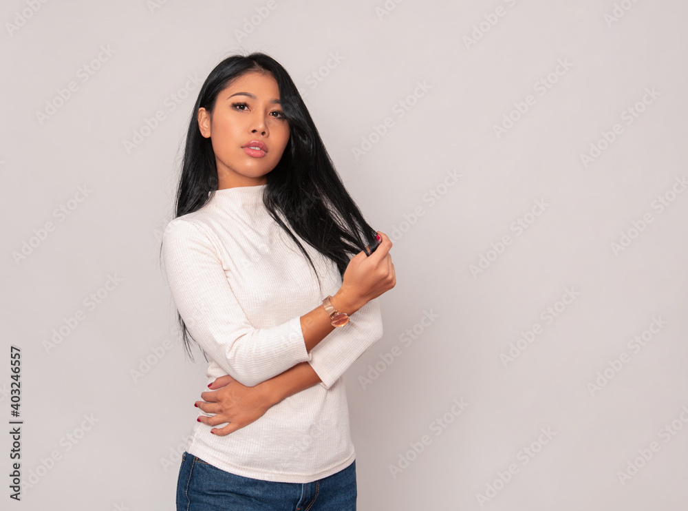 Beautiful young asian woman with long black hair wearing wrist watch Beautiful young asian woman with long black hair wearing wrist watch